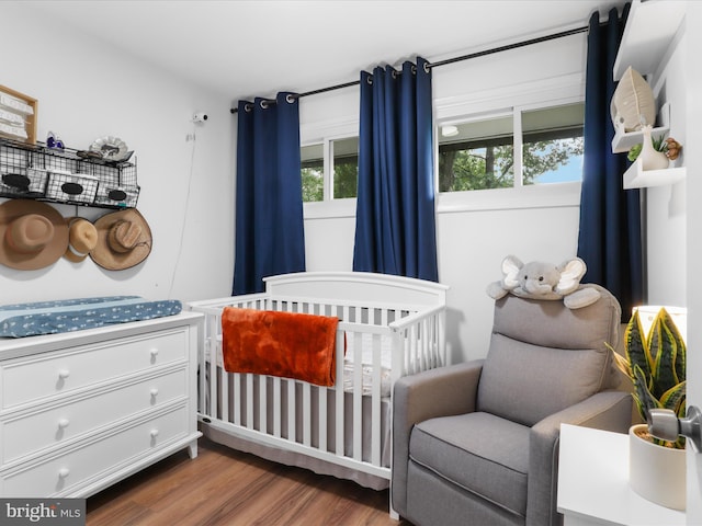 5902 Amelia St, Springfield, VA 22150 - bedroom with a crib and wood finished floors