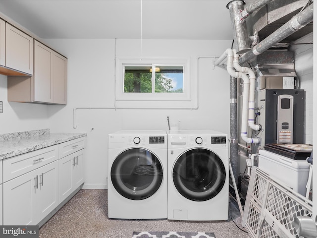 5902 Amelia St, Springfield, VA 22150 - laundry area with cabinet space, washer and clothes dryer, and baseboards