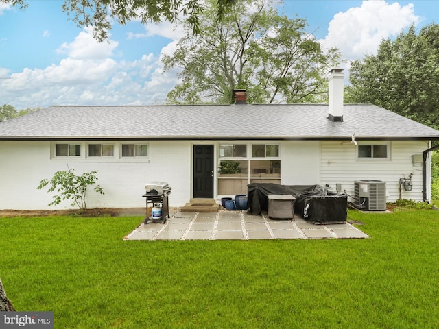 5902 Amelia St, Springfield, VA 22150 - back of house featuring a patio area, a yard, central air condition unit, and a chimney