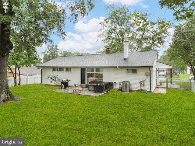 5902 Amelia St, Springfield, VA 22150 - back of house featuring central air condition unit, a patio area, a chimney, and a jacuzzi