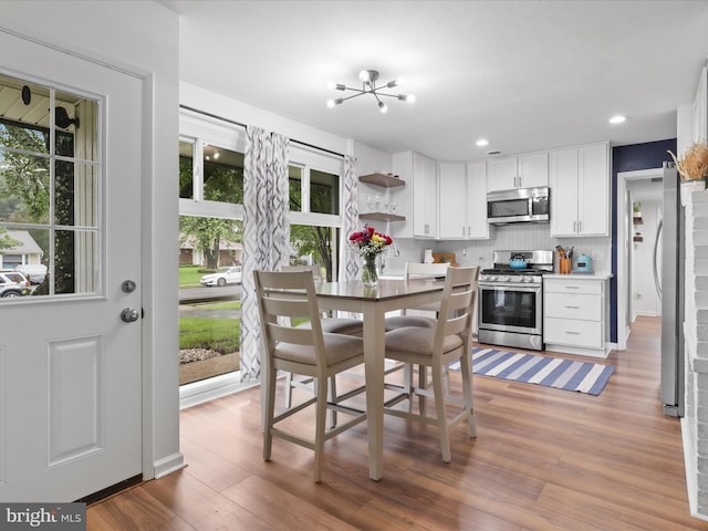 5902 Amelia St, Springfield, VA 22150 - dining area with light wood-style floors, recessed lighting, and a chandelier