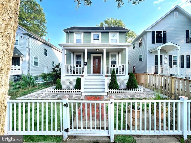 3009 Otis St NE, Washington, DC 20018 - view of front facade featuring covered porch, a fenced front yard, stairs, and a gate