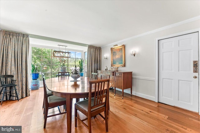 716 Old Gulph Rd, Bryn Mawr, PA 19010 - dining area with ornamental molding, light wood finished floors, and baseboards