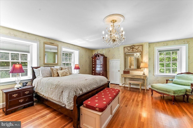 716 Old Gulph Rd, Bryn Mawr, PA 19010 - bedroom featuring light wood-style floors and a chandelier