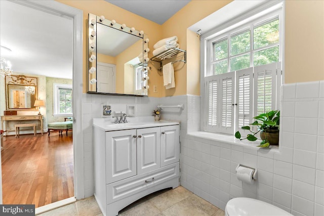 716 Old Gulph Rd, Bryn Mawr, PA 19010 - bathroom with tile walls, vanity, a wainscoted wall, and toilet