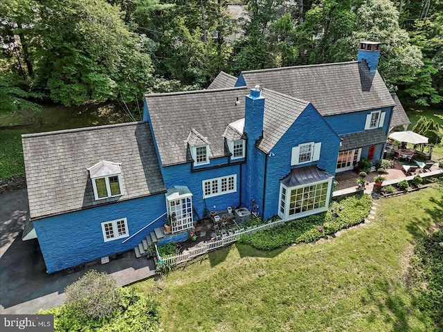 716 Old Gulph Rd, Bryn Mawr, PA 19010 - back of house featuring a chimney, a high end roof, french doors, and a lawn