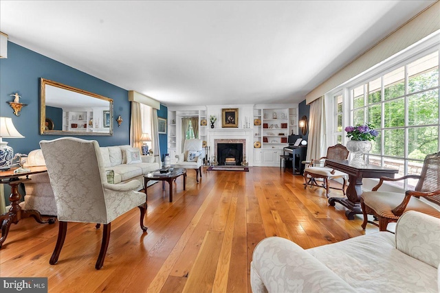 716 Old Gulph Rd, Bryn Mawr, PA 19010 - living room with light wood-style flooring and a fireplace with raised hearth