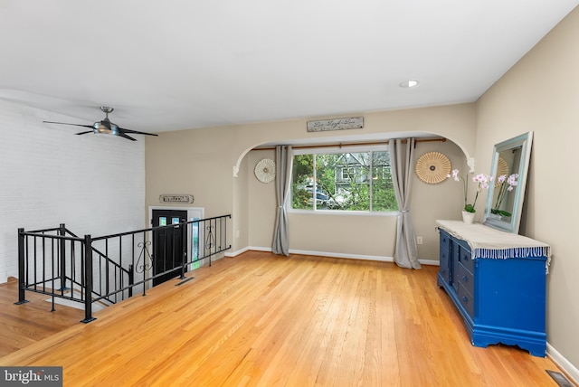 1157 Pine Tree Dr, Annapolis, MD 21409 - unfurnished room with arched walkways, light wood finished floors, and a ceiling fan