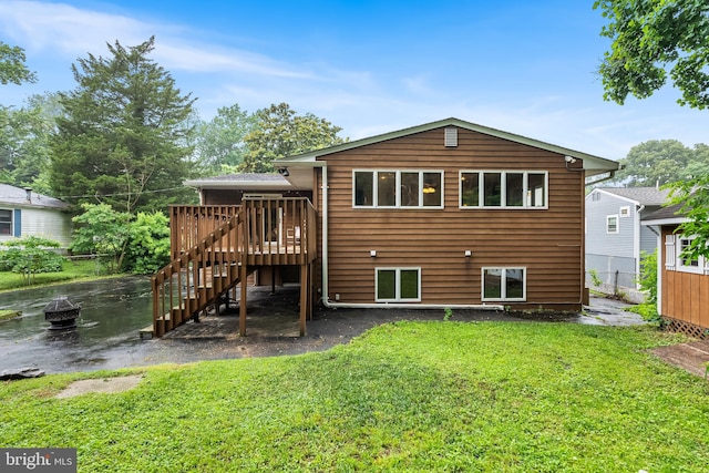 1157 Pine Tree Dr, Annapolis, MD 21409 - rear view of house with a wooden deck and stairway