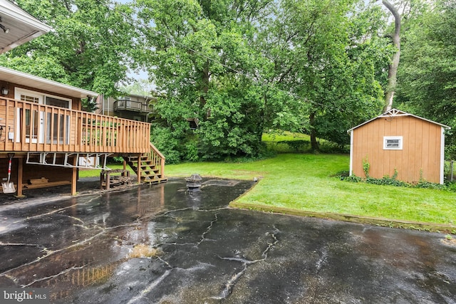 1157 Pine Tree Dr, Annapolis, MD 21409 - view of grassy yard featuring a wooden deck, stairway, a shed, and a patio area