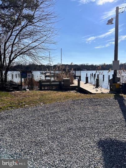 1157 Pine Tree Dr, Annapolis, MD 21409 - view of yard featuring a boat dock