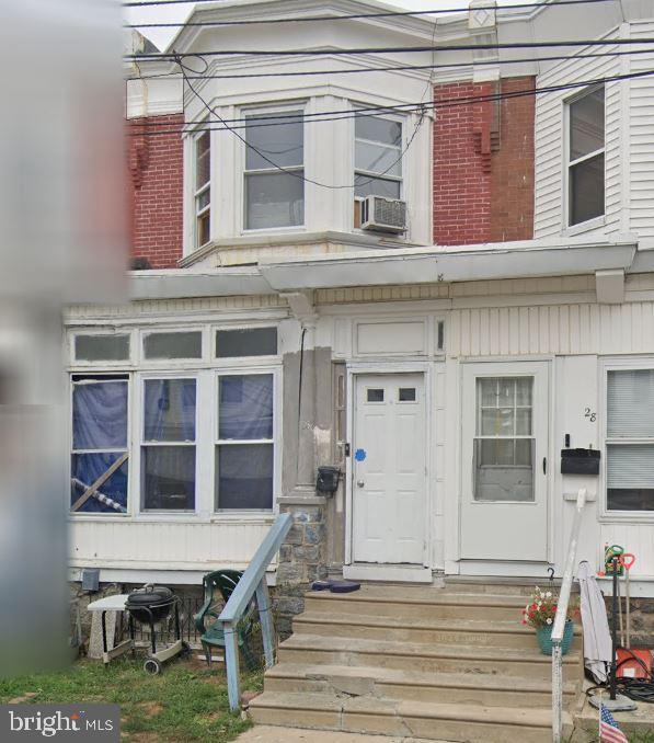 26 New St, Upper Darby, PA 19082 - view of front facade with cooling unit and entry steps