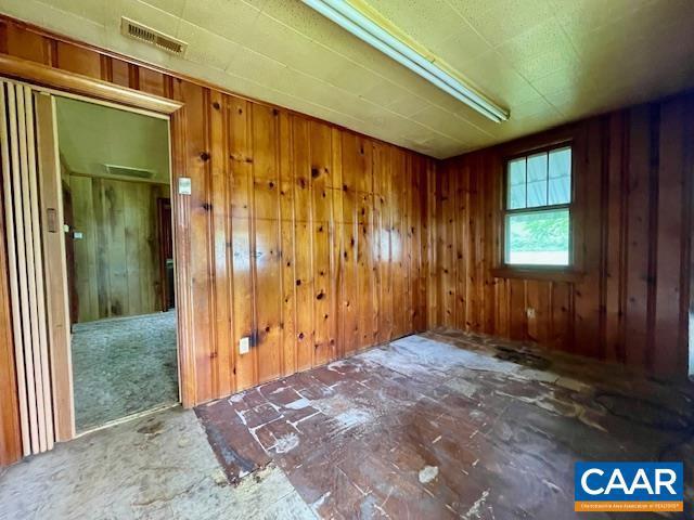 24 E 1st St, Craigsville, VA 24430 - empty room with wooden walls
