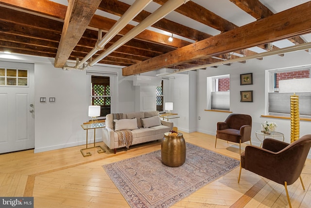 3551 13th St NW, Washington, DC 20010 - living room featuring light wood-type flooring, baseboards, plenty of natural light, and beamed ceiling