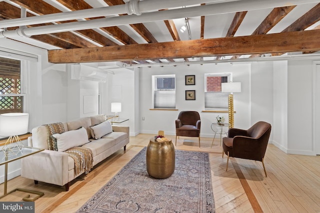 3551 13th St NW, Washington, DC 20010 - living room with light wood-style flooring, baseboards, and beamed ceiling