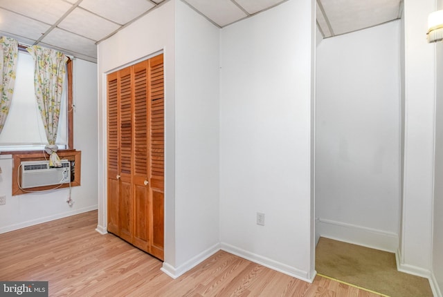 105 Ann St, Duncannon, PA 17020 - unfurnished bedroom featuring a closet, light wood-style floors, baseboards, and a paneled ceiling