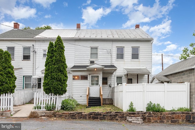 105 Ann St, Duncannon, PA 17020 - view of property featuring a chimney, entry steps, and metal roof