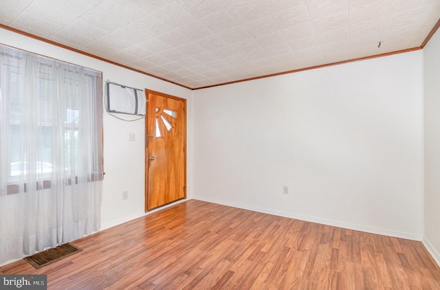 105 Ann St, Duncannon, PA 17020 - empty room featuring crown molding, light wood-style floors, and baseboards