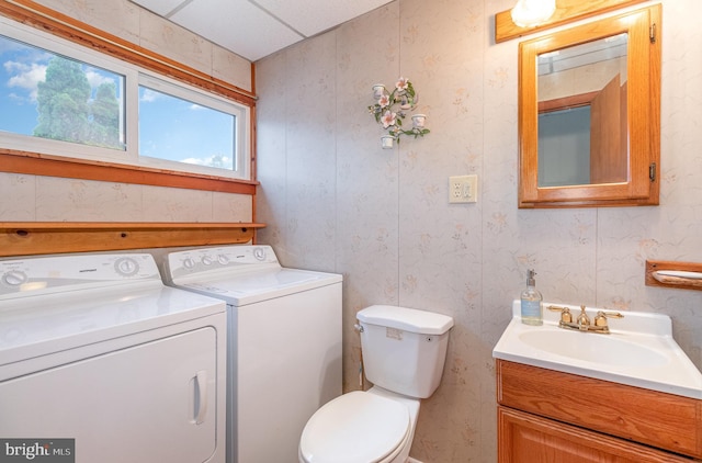 105 Ann St, Duncannon, PA 17020 - half bath with washer and clothes dryer, vanity, toilet, and wallpapered walls