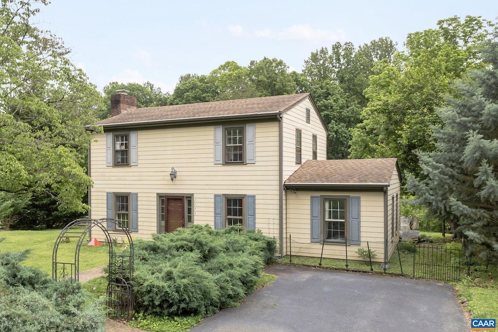 1775 Easy Ln, Charlottesville, VA 22911 - colonial house featuring a chimney and a shingled roof
