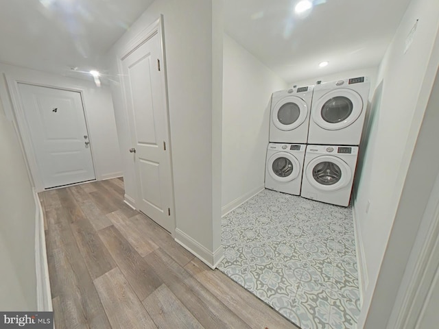 3228 W Diamond St, Philadelphia, PA 19121 - washroom featuring stacked washer / dryer and wood finished floors