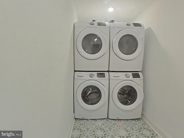 3228 W Diamond St, Philadelphia, PA 19121 - washroom featuring stacked washer / drying machine and light tile patterned flooring