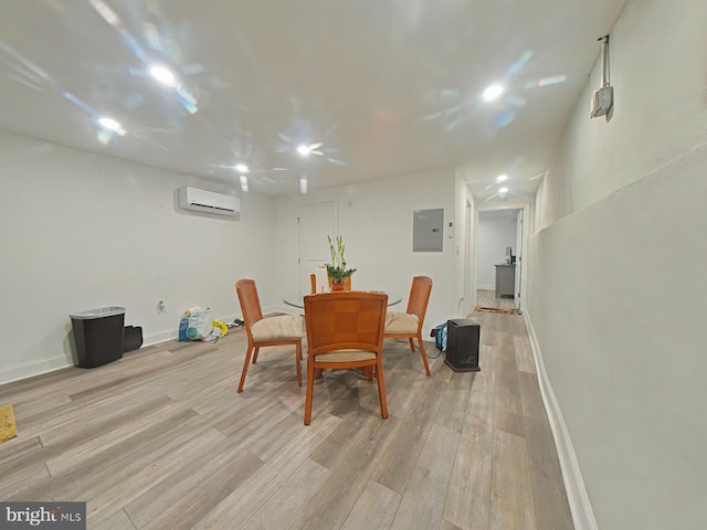 3228 W Diamond St, Philadelphia, PA 19121 - dining space with a wall mounted air conditioner, light wood-style floors, electric panel, and recessed lighting