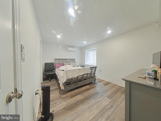 3228 W Diamond St, Philadelphia, PA 19121 - bedroom with a wall unit AC, light wood-style floors, and recessed lighting