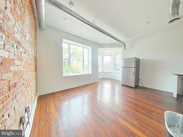 3228 W Diamond St, Philadelphia, PA 19121 - unfurnished living room featuring baseboards and dark wood-style floors