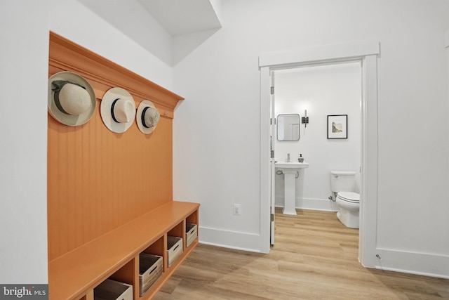 17941 Woods Overlook Dr, Dumfries, VA 22026 - mudroom with wood finished floors, baseboards, and a sink