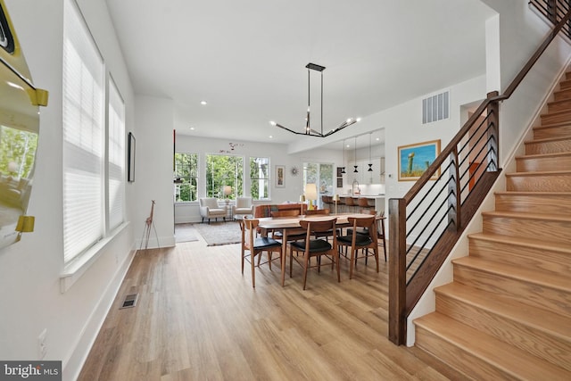 17941 Woods Overlook Dr, Dumfries, VA 22026 - dining area with stairway, light wood-style floors, recessed lighting, baseboards, and a chandelier