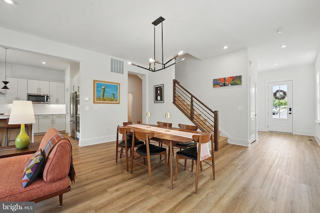 17941 Woods Overlook Dr, Dumfries, VA 22026 - dining room featuring light wood-type flooring, stairs, baseboards, a chandelier, and recessed lighting