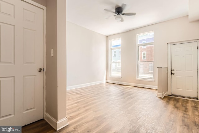2228 W Baltimore St, Baltimore, MD 21223 - entryway with wood finished floors, baseboards, and ceiling fan