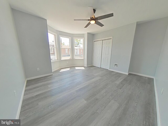 134 N Hobart St, Philadelphia, PA 19139 - unfurnished bedroom with wood finished floors, baseboards, and a closet