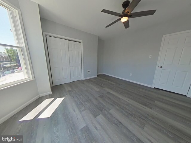 134 N Hobart St, Philadelphia, PA 19139 - unfurnished bedroom with wood finished floors, baseboards, a closet, and a ceiling fan