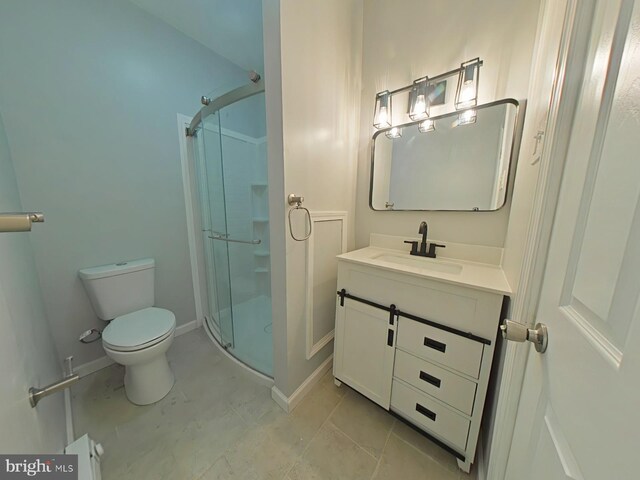134 N Hobart St, Philadelphia, PA 19139 - bathroom with toilet, a shower stall, vanity, tile patterned flooring, and baseboards