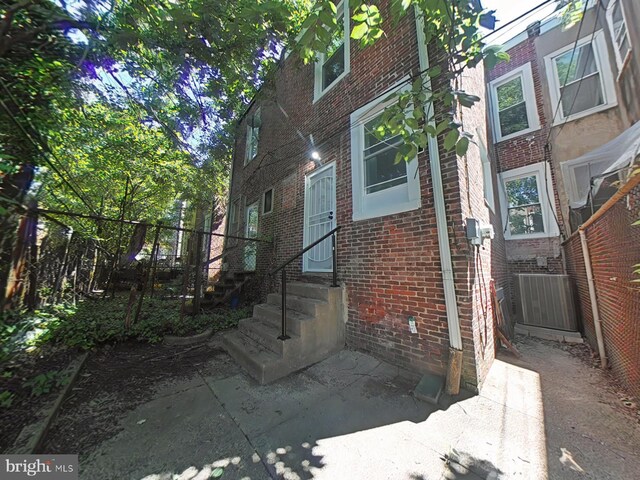 134 N Hobart St, Philadelphia, PA 19139 - property entrance featuring brick siding and cooling unit