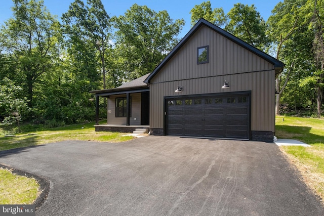 13 Connie Trl, Fairfield, PA 17320 - view of front of house featuring covered porch, driveway, a front lawn, and a garage