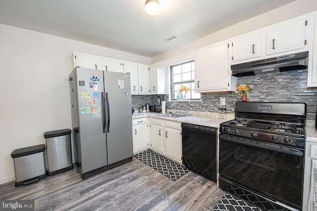536 Cormorant Dr, Voorhees, NJ 08043 - kitchen with black appliances, under cabinet range hood, a sink, dark wood-style floors, and light countertops