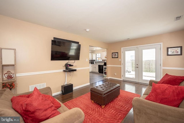 536 Cormorant Dr, Voorhees, NJ 08043 - living room featuring french doors, hardwood / wood-style flooring, and baseboards