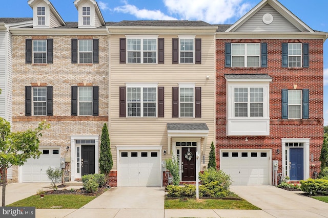9440 Adelaide Ln, Owings Mills, MD 21117 - view of property with driveway, a garage, and brick siding