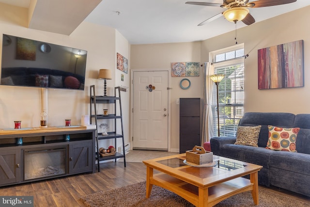 7136 Daniel John Dr, Elkridge, MD 21075 - living room with dark wood finished floors, ceiling fan, and a baseboard radiator