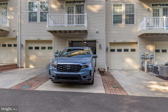 7136 Daniel John Dr, Elkridge, MD 21075 - view of front of property featuring a garage, driveway, and a balcony
