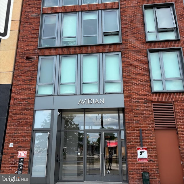 1211 Van St SE Unit 310, Washington, DC 20003 - view of exterior entry featuring brick siding