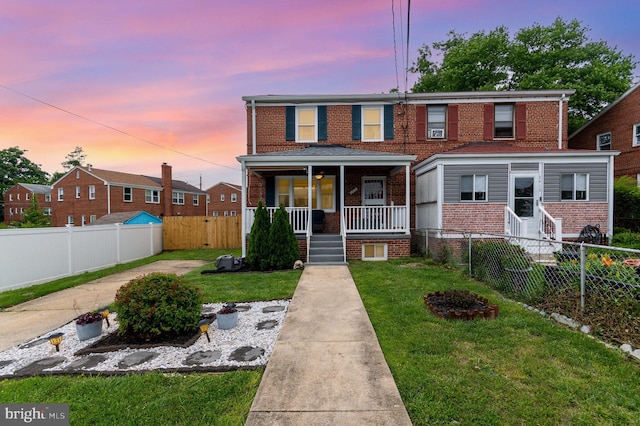 2410 Saint Clair Dr, Temple Hills, MD 20748 - townhome / multi-family property with brick siding and covered porch