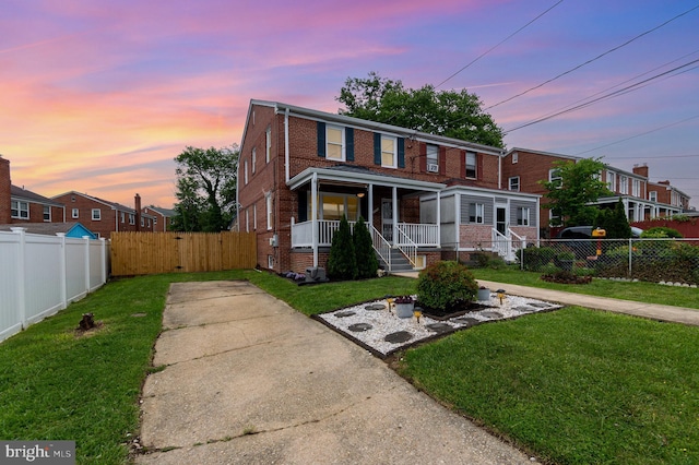 2410 Saint Clair Dr, Temple Hills, MD 20748 - view of property with brick siding, a porch, and driveway