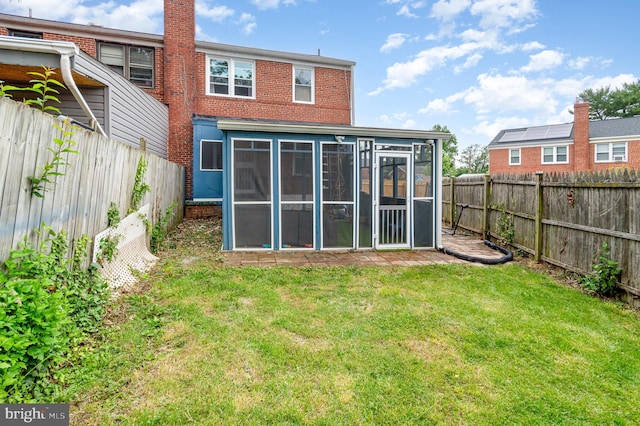 2410 Saint Clair Dr, Temple Hills, MD 20748 - back of property with a sunroom and brick siding