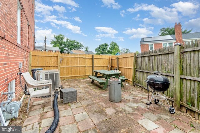 2410 Saint Clair Dr, Temple Hills, MD 20748 - fenced backyard featuring central AC unit, a patio area, and a grill