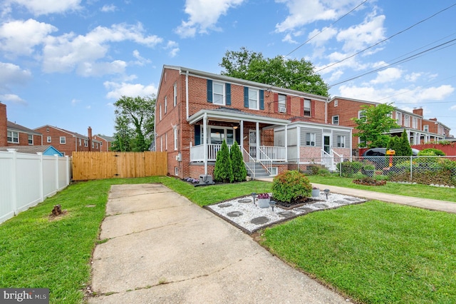2410 Saint Clair Dr, Temple Hills, MD 20748 - view of property featuring brick siding, covered porch, and concrete driveway