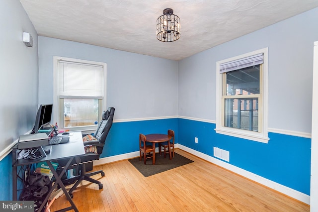 2410 Saint Clair Dr, Temple Hills, MD 20748 - office with hardwood / wood-style floors, baseboards, and a chandelier